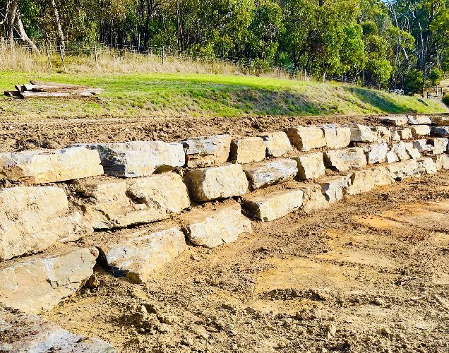 Retaining wall on sloped ground